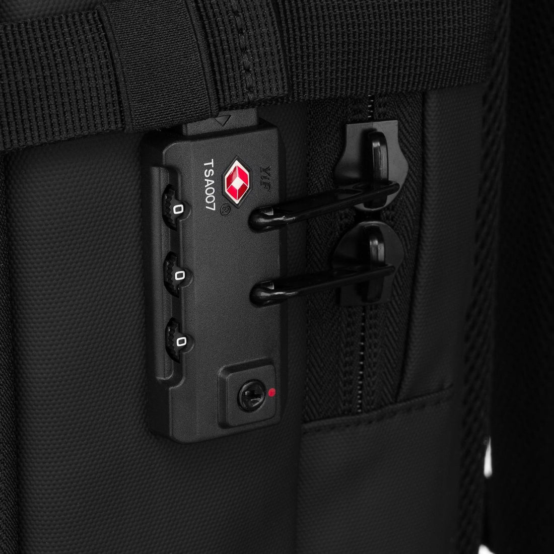 TSA-accepted combination lock fastened through the main zip pulls of the Airbag Lite carry-on backpack